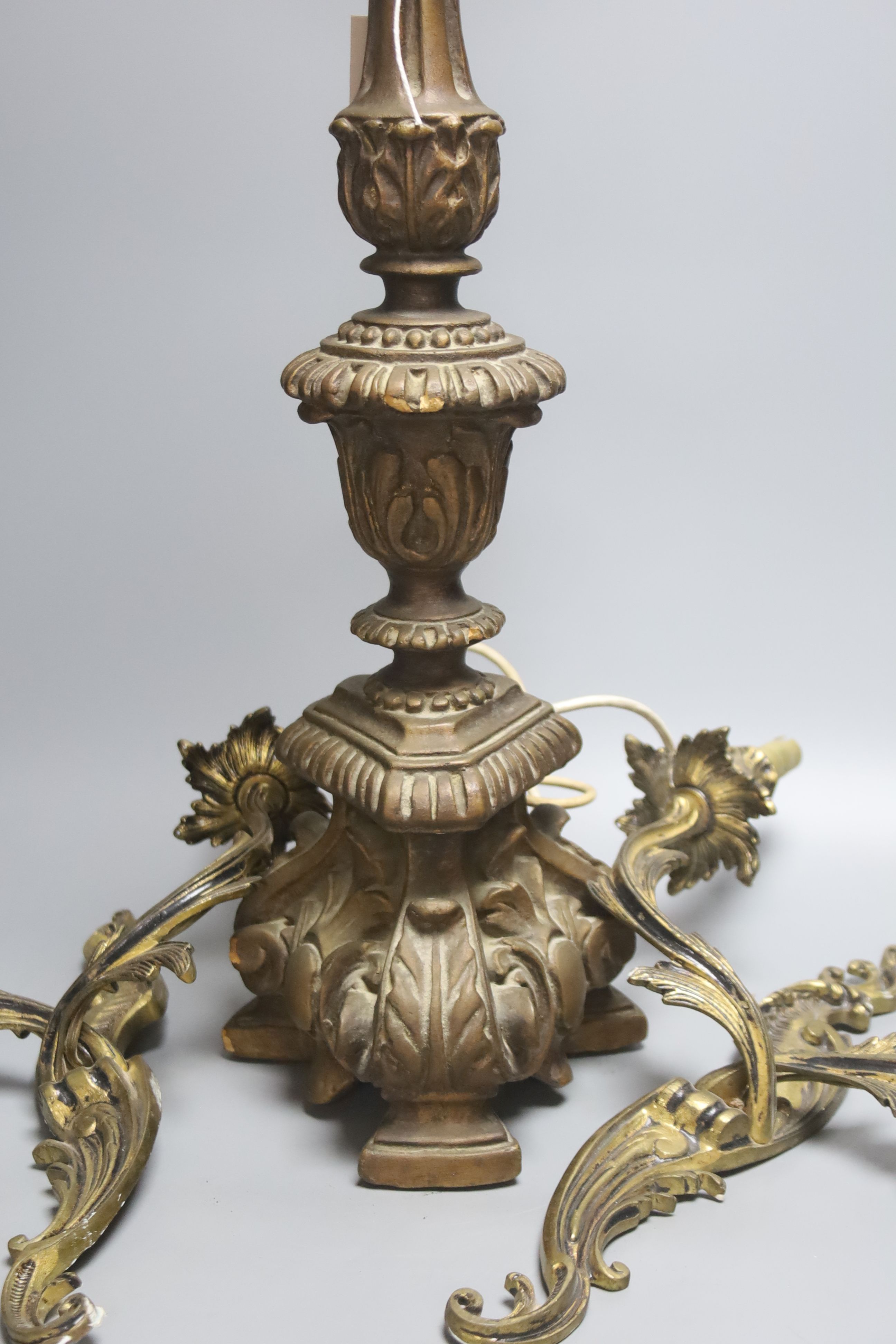 A pair of rococo style twin light wall sconces, and an Italian period style giltwood table lamp, height 56cm